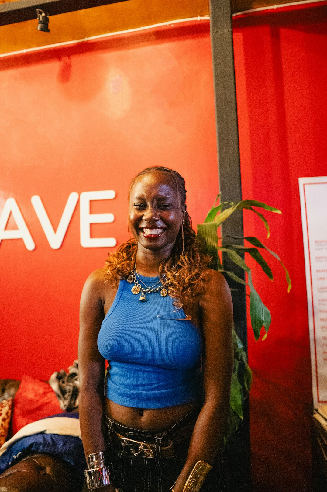 Portrait of a Black woman gallery producer smiling