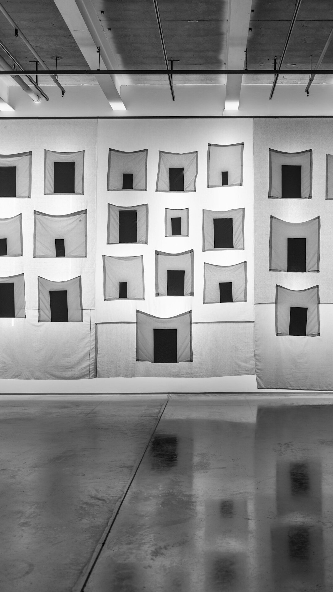 Overhead studio lighting grid with LED panels and softboxes